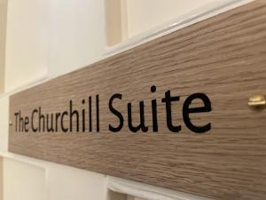 a sign that says the churchill sulfide on a door at The Randolph Hotel in Southwold