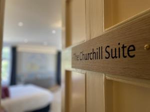 a sign that says churchill suite on a door at The Randolph Hotel in Southwold