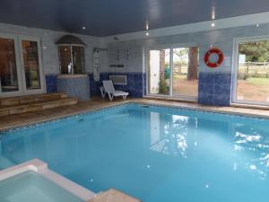 a large swimming pool in a house at The Orchard in Rye
