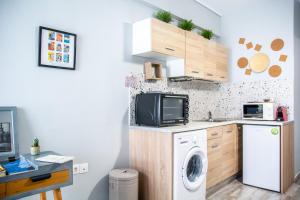 Kuchyň nebo kuchyňský kout v ubytování Ermou 18 Mosaics boutique apartment