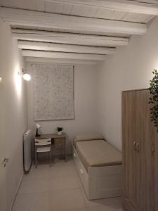 Posteľ alebo postele v izbe v ubytovaní Cozy apartment near Palermo Cathedral