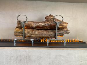 a pair of scissors on top of a fireplace at Les Trois Chaufatons - Chalets Boutiques in Montriond