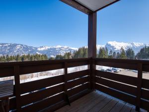 a balcony with a view of the mountains at Appartement Morillon 1100, 3 pièces, 7 personnes - FR-1-642-1 in Morillon