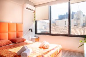 Postel nebo postele na pokoji v ubytování Ermou 18 Mosaics boutique apartment