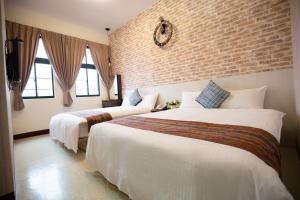 Postel nebo postele na pokoji v ubytování Jia-Jia Business Hotel