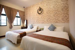 Postel nebo postele na pokoji v ubytování Jia-Jia Business Hotel