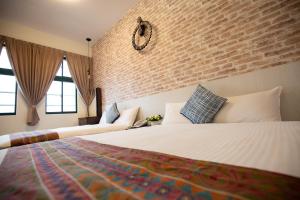 Postel nebo postele na pokoji v ubytování Jia-Jia Business Hotel