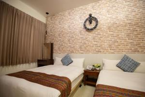 Postel nebo postele na pokoji v ubytování Jia-Jia Business Hotel
