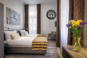 Posteľ alebo postele v izbe v ubytovaní Hotel Páv