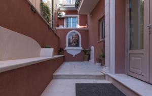 an empty hallway of a building with a statue on the wall at Capolavoro Suites in Zakynthos