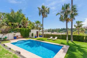 The swimming pool at or close to Ocean Views Luxury Villa next to beach