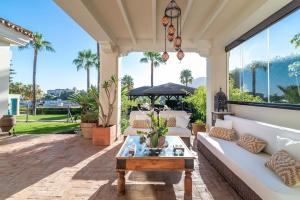 A garden outside Ocean Views Luxury Villa next to beach