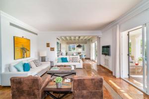 A seating area at Ocean Views Luxury Villa next to beach