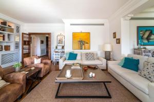 A seating area at Ocean Views Luxury Villa next to beach