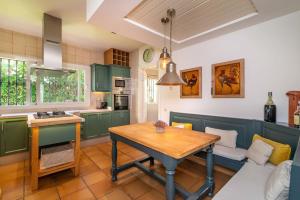A kitchen or kitchenette at Ocean Views Luxury Villa next to beach