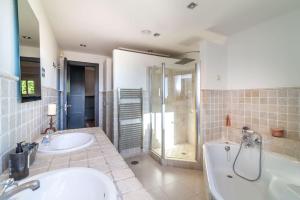 A bathroom at Ocean Views Luxury Villa next to beach