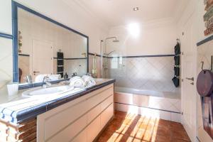 A bathroom at Ocean Views Luxury Villa next to beach