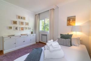 A bed or beds in a room at Ocean Views Luxury Villa next to beach