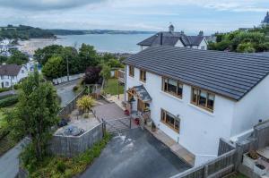 an aerial view of a house with a roof at Bayview House - 4 Bedroom Luxurious Holiday Home - Saundersfoot in Saundersfoot