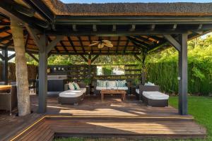A garden outside Ocean Views Luxury Villa next to beach
