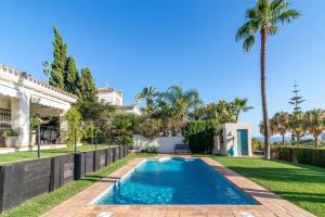 The swimming pool at or close to Ocean Views Luxury Villa next to beach
