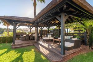 A garden outside Ocean Views Luxury Villa next to beach