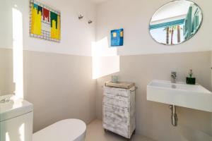 A bathroom at Ocean Views Luxury Villa next to beach