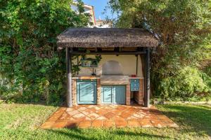 A garden outside Ocean Views Luxury Villa next to beach