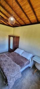 Ein Bett oder Betten in einem Zimmer der Unterkunft Chácara Brisa Do Rio