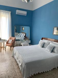 A bed or beds in a room at A casa di Nonna Mela