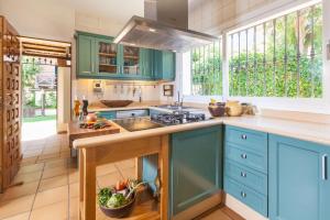A kitchen or kitchenette at Ocean Views Luxury Villa next to beach