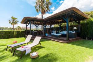 A garden outside Ocean Views Luxury Villa next to beach
