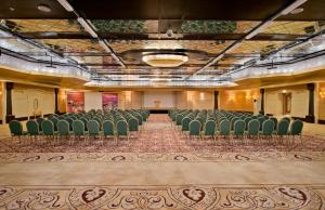 an empty room with green chairs in a building at Kamelya Selin Hotel Luxury Resort & SPA in Side +228 photos