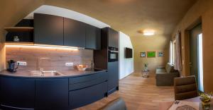 a kitchen with a sink and a counter top at Villa Bergzauber in Rossleithen