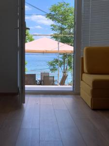 a living room with a view of the ocean at Puro LakeSide in Struga