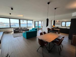 a living room with a table and a couch at The View Luxury Residence with Pool in Zadar