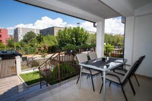 a table and chairs on a balcony with a view at Studio Apartment Noah in Rovinj