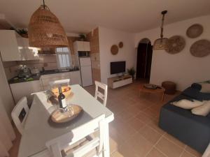 A kitchen or kitchenette at COZY, Beach House , by MAHBOVILLAS