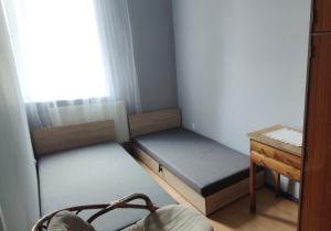 Postel nebo postele na pokoji v ubytování Tanie Spanie przy City Park - Zameldowanie Bezobsługowe -