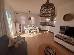 A kitchen or kitchenette at COZY, Beach House , by MAHBOVILLAS