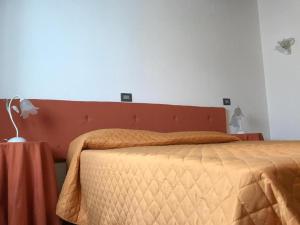 A bed or beds in a room at Il Pianetto Holiday Accomodation