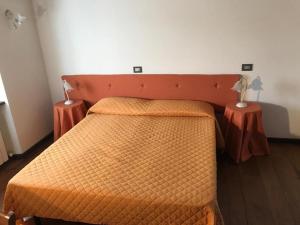 A bed or beds in a room at Il Pianetto Holiday Accomodation