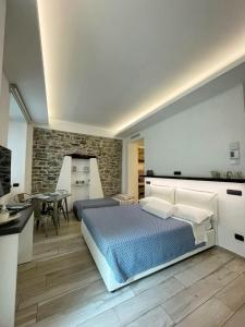a bedroom with a king sized bed and a table at Civico29 Rooms & Breakfast in Como