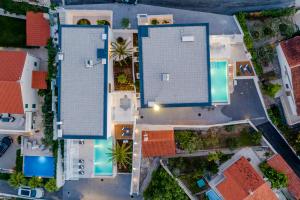 an overhead view of three buildings in a neighborhood at Villa Vitae & Villa Pax in Sutivan