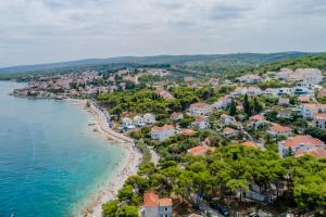 an aerial view of a beach in a resort at Villa Vitae & Villa Pax in Sutivan