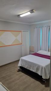 Säng eller sängar i ett rum på Hotel Porthal da Ilha- Paulo Afonso-Ba