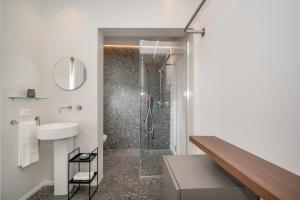 a bathroom with a shower and a sink at BED 10.5 - DESIGN SUITE in Castellammare del Golfo