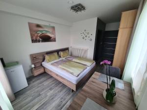 Letto o letti in una camera di Orchidea2