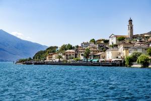 a town on the shore of a body of water at Appartamento Scalinata San Rocco in Limone sul Garda