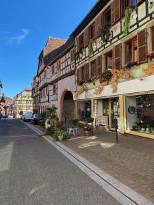 a street in a town with buildings on the side of the road at Tiers Lieu 59 Grand Rue in Bouxwiller